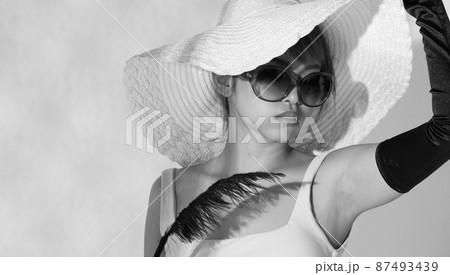 Half body Asian Woman 20s wear Bikini sunglasses beach hat and gloves stay in sun and reflect Half body Asian Woman 20s wear Bikini sunglasses beach hat and gloves stay in sun and reflect 87493439