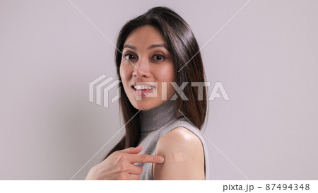 Young woman is happy she was vaccinated 87494348