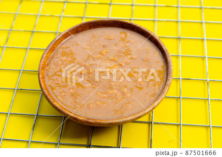 Salted soy beans paste in wooden bowl Salted soy beans paste in wooden bowl 87501666