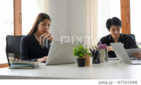 Female assistant having a formal meeting with board members. Female assistant having a formal meeting with board members. 87502066