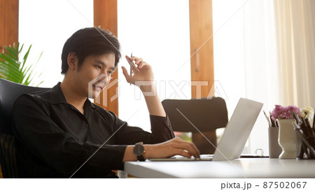 Focused businessman concentrated working on laptop. Focused businessman concentrated working on laptop. 87502067