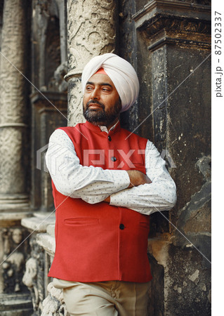 Portrait of Indian sikh man in turban with bushy beard Portrait of Indian sikh man in turban with bushy beard 87502337