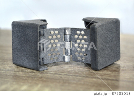 Gray abstract model printed on 3d printer from powder on background. 87505013