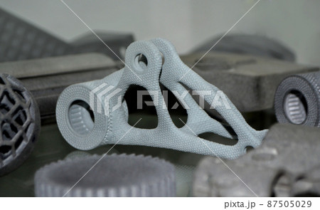 Gray object printed on powder industrial 3D printer. Three-dimensional 87505029