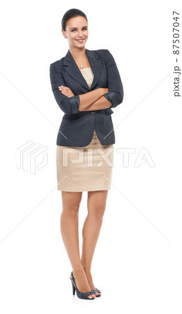 Shell be the boss soon. Studio portrait of a confident young businesswoman isolated on white. Shell be the boss soon. Studio portrait of a confident young businesswoman isolated on white. 87507047