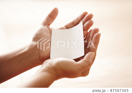 Taking your requests. Hands holding out a blank piece of copyspace like a request. Taking your requests. Hands holding out a blank piece of copyspace like a request. 87507305