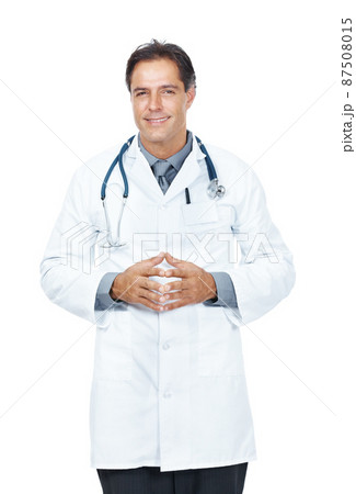 Confident middle aged doctor standing isolated on white. Portrait of a confident middle aged doctor standing isolated on white background. Confident middle aged doctor standing isolated on white. Portrait of a confident middle aged doctor standing isolated on white background. 87508015