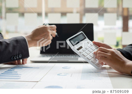 Business leaders talk about charts, financial graphs showing results are analyzing and calculating planning strategies, business success building processes 87509109
