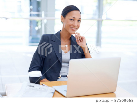 Getting work done. A young ethnic businesswoman using her laptop. 87509668