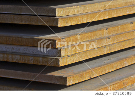 Sheet metal is in bundles in the warehouse 87510399