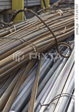 Reinforcing bars with a periodic profile in the packs are stored in the metal products warehouse Reinforcing bars with a periodic profile in the packs are stored in the metal products warehouse 87510707