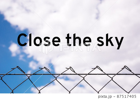 Close the sky over Ukraine. Metal mesh covers the sky over peaceful people. Concept of freedom and independence. 87517405