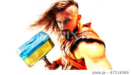 Conceptual collage with brave, courage man, warrior with huge hammer painted in blue-yellow colors of ukrainian flag. 87518369