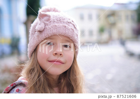 Portrait of cute little child girl in pink hat 87521606