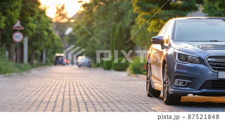 Close up of a car parked on city street side. Urban traffic concept Close up of a car parked on city street side. Urban traffic concept 87521848