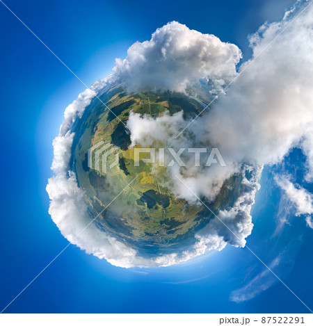 Aerial view from high altitude of little planet earth covered with white puffy cumulus clouds on sunny day Aerial view from high altitude of little planet earth covered with white puffy cumulus clouds on sunny day 87522291