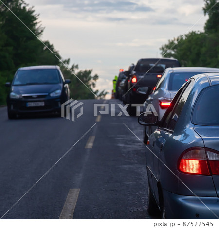 traffic jams on the road are associated with the repair of the roadway. evening traffic jams on the road are associated with the repair of the roadway. evening 87522545