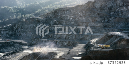 Stone drilling and crushing machines working in diabase quarry Stone drilling and crushing machines working in diabase quarry 87522923