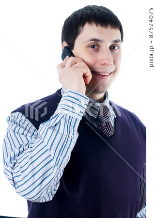 Young businessman talking by mobile phone 87524075