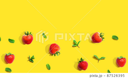 Fresh red strawberries with mints overhead view Fresh red strawberries with mints overhead view 87526395