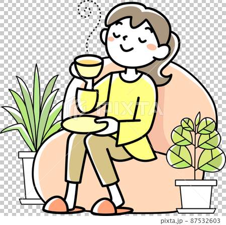 お茶を飲んでリラックスする若い女性 87532603