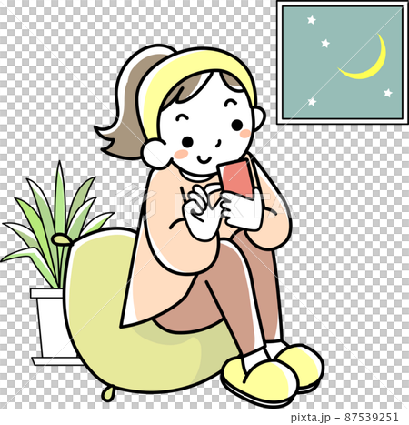 A young woman who stays up late looking at her smartphone 87539251