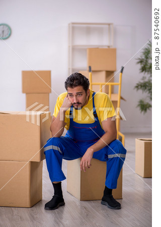 Young male contractor doing home relocation Young male contractor doing home relocation 87540692
