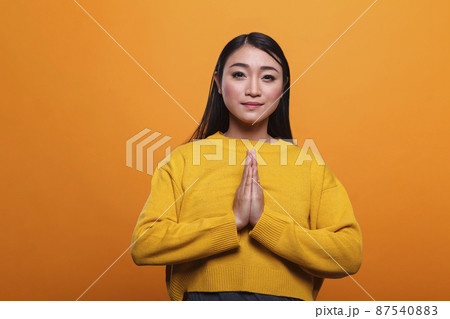 Spiritual religious beautiful woman praying in silence and devotion to achieve enlightenment. Spiritual religious beautiful woman praying in silence and devotion to achieve enlightenment. 87540883