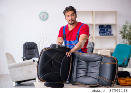 Young male repairman working at workshop Young male repairman working at workshop 87541118