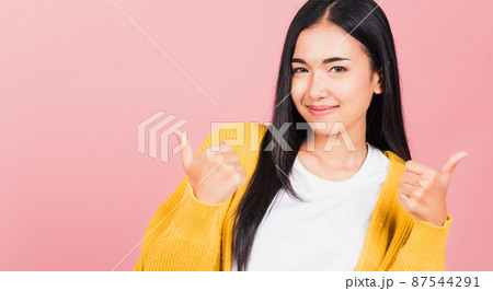 Portrait Asian beautiful young woman smile she standing made finger thumbs up 87544291