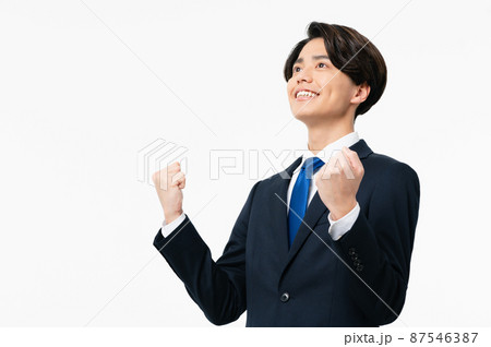 ガッツポーズする若いビジネスマン 87546387