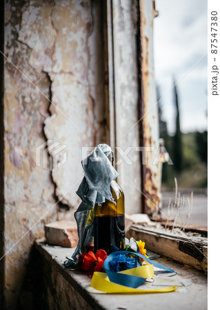 Molotov cocktail and symbols of Ukraine Stop War 87547380