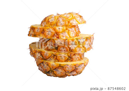 Pineapple fruit and Pineapple slices isolated on a white background. Pineapple fruit and Pineapple slices isolated on a white background. 87548602
