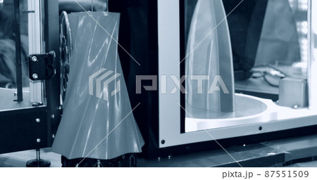 3D printer works and creates an object from the hot molten plastic 3D printer works and creates an object from the hot molten plastic 87551509
