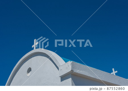 Traditional white chapel with a blue roof on the seaside. Agioi Anargyroi, Cyprus 87552860
