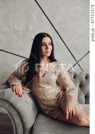 Gorgeous brunette in laced dress with make up. 87553278