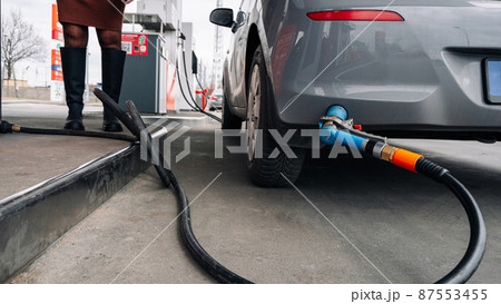 Fuel car. Pump petrol from nozzle in vehicle tank. Gasoline, oil gas station. Economy business with diesel transport. Automotive transportation concept. Fuel car. Pump petrol from nozzle in vehicle tank. Gasoline, oil gas station. Economy business with diesel transport. Automotive transportation concept. 87553455