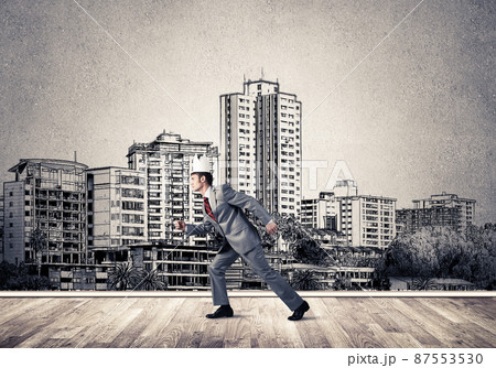 King businessman in elegant suit running and drawn cityscape silhouette at background King businessman in elegant suit running and drawn cityscape silhouette at background 87553530