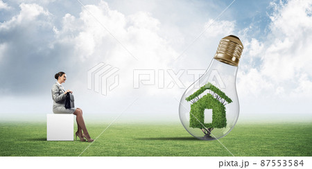 Attractive business lady or accountant outdoors on white box 87553584