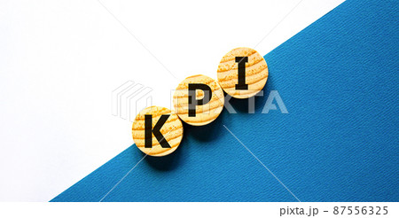 KPI, key performance indicator symbol. Concept word KPI, key performance indicator on wooden circles on beautiful white background, copy space. Business, KPI, key performance indicator concept. KPI, key performance indicator symbol. Concept word KPI, key performance indicator on wooden circles on beautiful white background, copy space. Business, KPI, key performance indicator concept. 87556325