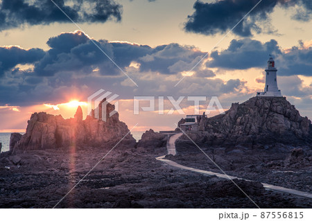 Road to La Corbiere lighthouse with cliff and sunset,  bailiwick of Jersey, Channel Islands 87556815