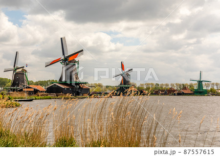 Colorful Dutch Windmills at the river Zaan, Zaanse Schans, Zaandam, The Netherlands Colorful Dutch Windmills at the river Zaan, Zaanse Schans, Zaandam, The Netherlands 87557615