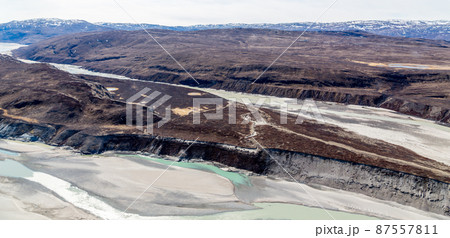 Greenlandic tundra landscape with river from ice cap melting, aerial view, Kangerlussuaq, Greenland Greenlandic tundra landscape with river from ice cap melting, aerial view, Kangerlussuaq, Greenland 87557811