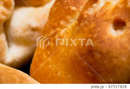 Selective focus close-up of freshly baked yeast, puff dough strudel. Pastries and bakery products 87557828