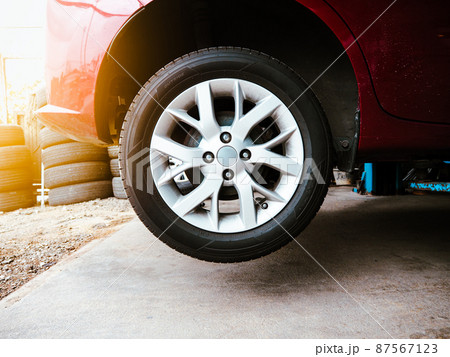 Vehicle hydraulic floor jack raises the car body for repairs in an auto repair garage 87567123