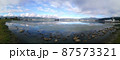Panorama view of the Lake Suwa in the Kiso Mountains, Nagano, Japan. 87573321
