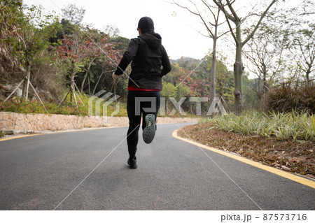 Asian woman jogging in park Asian woman jogging in park 87573716