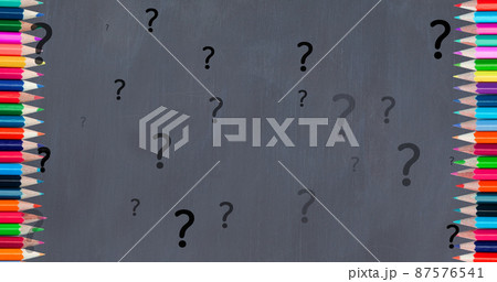 Image of question marks over crayons on grey background Image of question marks over crayons on grey background 87576541