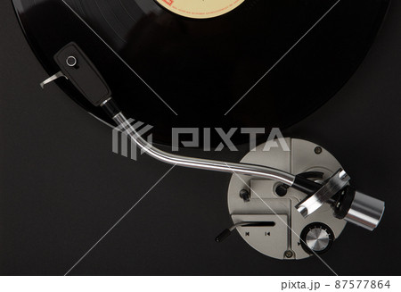 Vintage record player with vinyl disc, close-up. 87577864