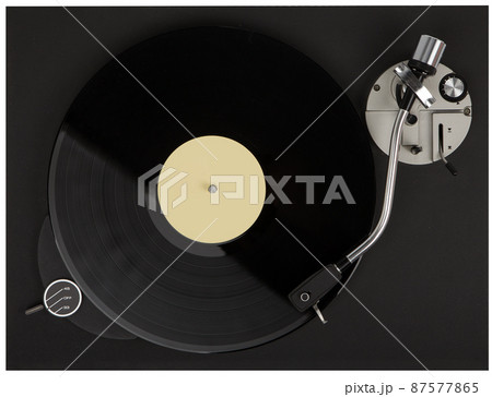 Turntable playing vinyl close up with needle on the record. Turntable playing vinyl close up with needle on the record. 87577865